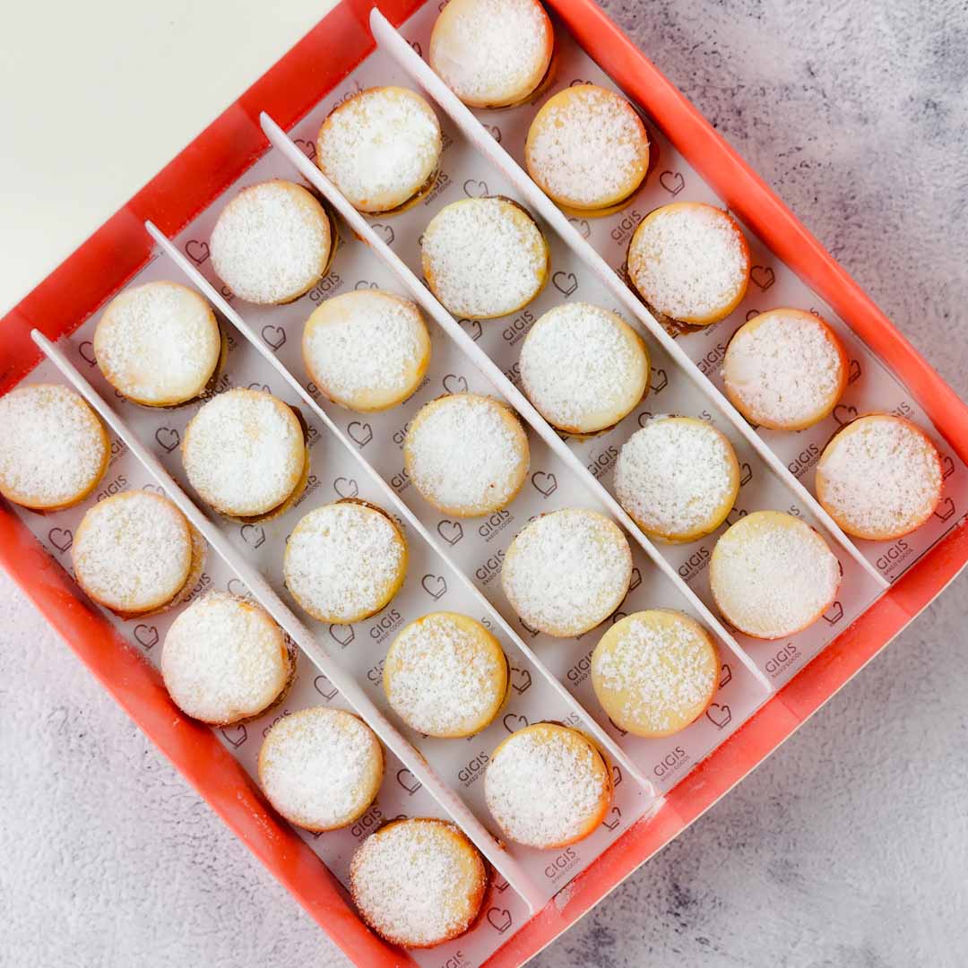 Each cookie is a perfect balance of crumbly and creamy, with a delicious filling of dulce de leche. Order now and taste the magic of our alfajores